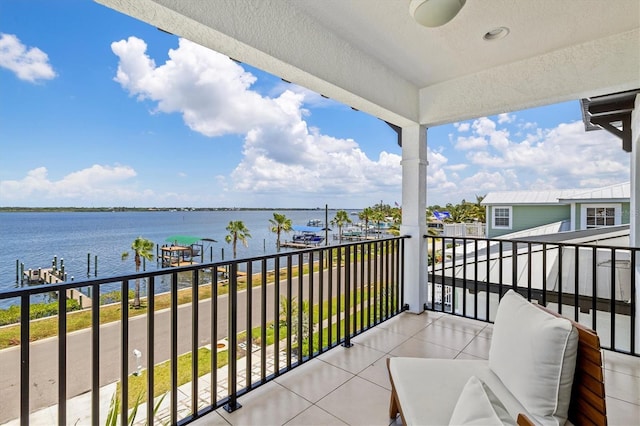 balcony featuring a water view