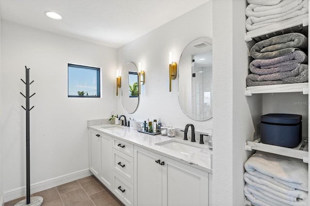 bathroom featuring vanity and tile patterned flooring