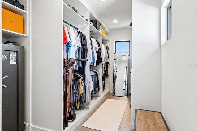 spacious closet with light tile patterned floors