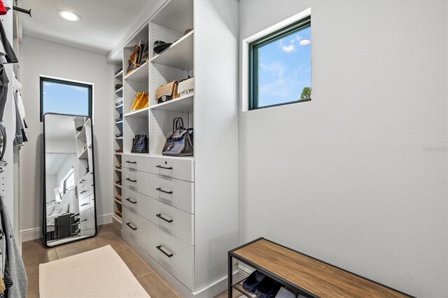 walk in closet featuring light tile patterned floors