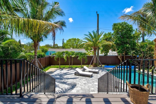 view of patio with a fenced in pool