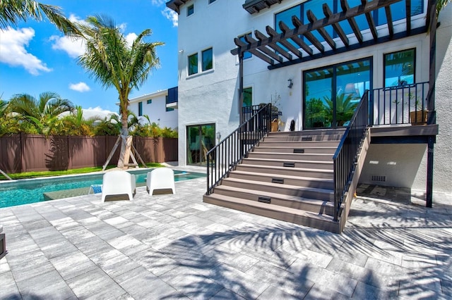 view of patio / terrace featuring a fenced in pool and a pergola