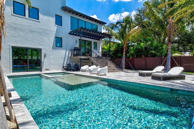 view of pool with a pergola, a patio, and an in ground hot tub