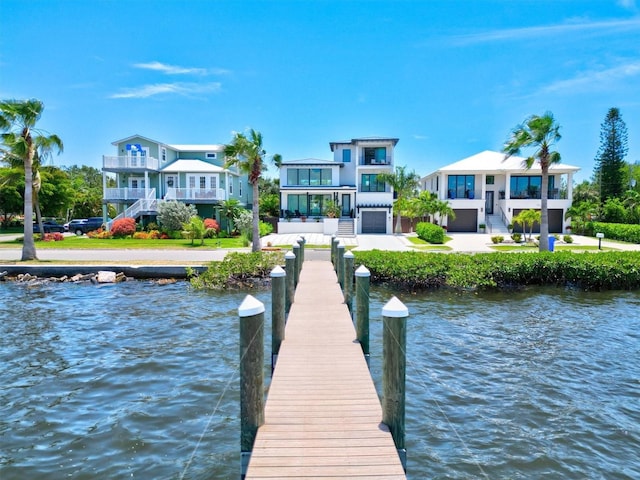 dock area featuring a balcony and a water view