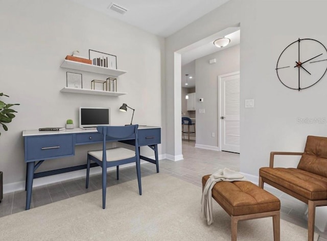 home office with tile patterned flooring