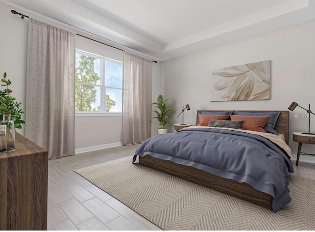 bedroom with a raised ceiling