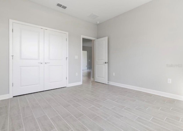 unfurnished bedroom with a closet