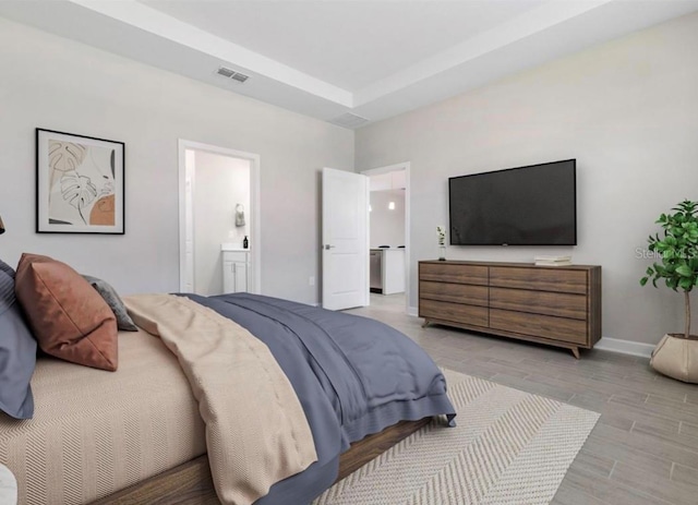 bedroom featuring ensuite bath