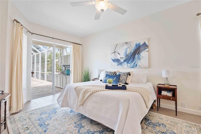 bedroom featuring ceiling fan, access to outside, and light wood-type flooring