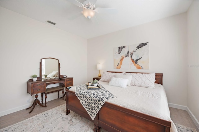 bedroom with ceiling fan and light wood-type flooring