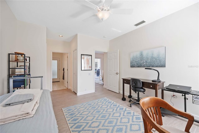 office featuring recessed lighting, visible vents, a ceiling fan, light wood-type flooring, and baseboards