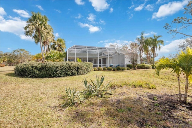 view of yard featuring glass enclosure