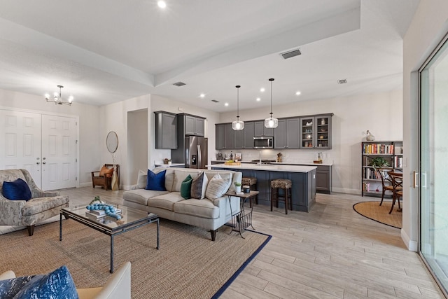 living room featuring a chandelier