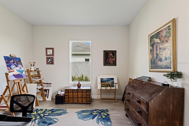 sitting room featuring light hardwood / wood-style flooring