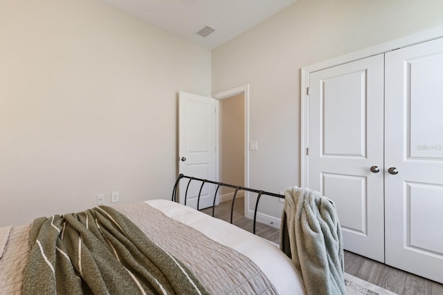 bedroom featuring a closet and hardwood / wood-style floors