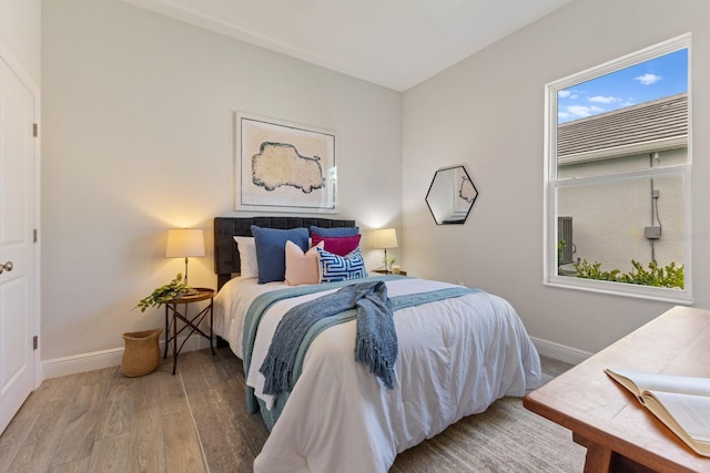 bedroom with hardwood / wood-style floors