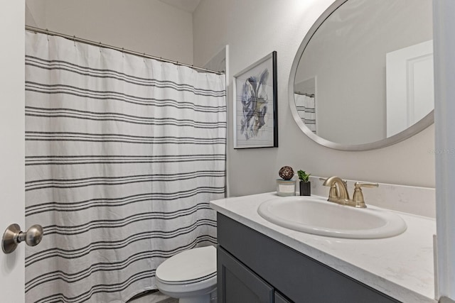 bathroom with toilet and vanity