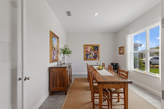 dining space featuring light hardwood / wood-style flooring