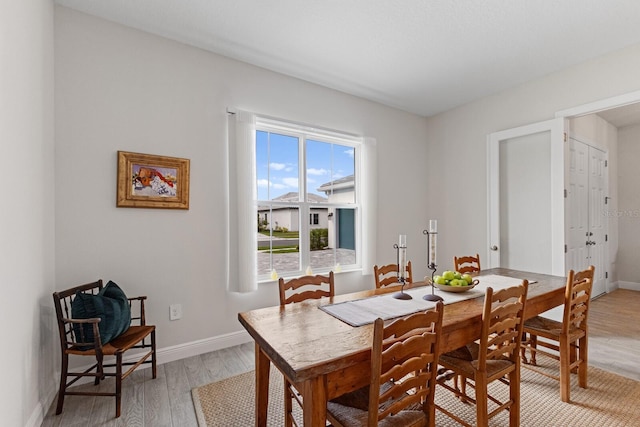 dining space featuring light hardwood / wood-style floors