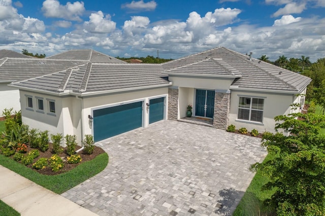 view of front of property with a garage