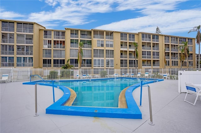 view of swimming pool featuring a patio area