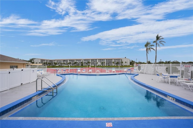 view of swimming pool featuring a patio