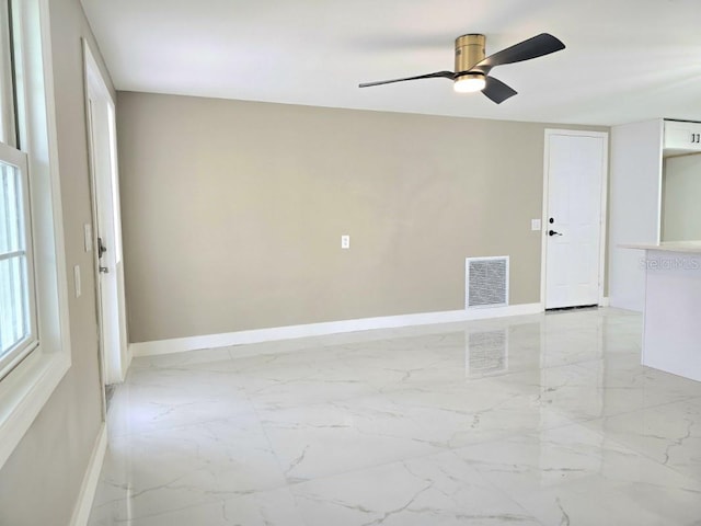 unfurnished room featuring ceiling fan