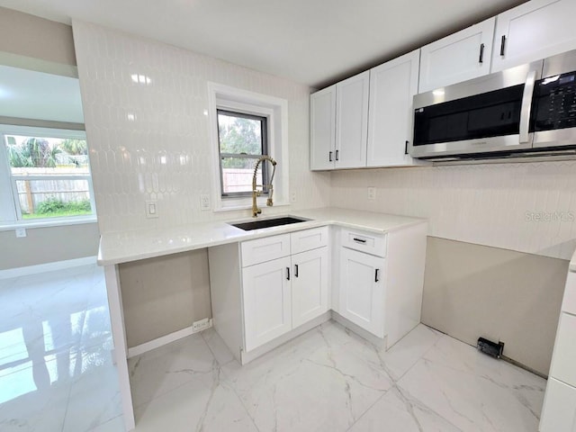 kitchen with white cabinets and sink