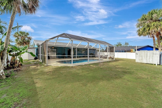 view of yard featuring a fenced in pool and a lanai