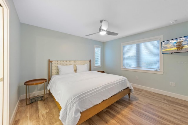 bedroom featuring ceiling fan and light hardwood / wood-style flooring