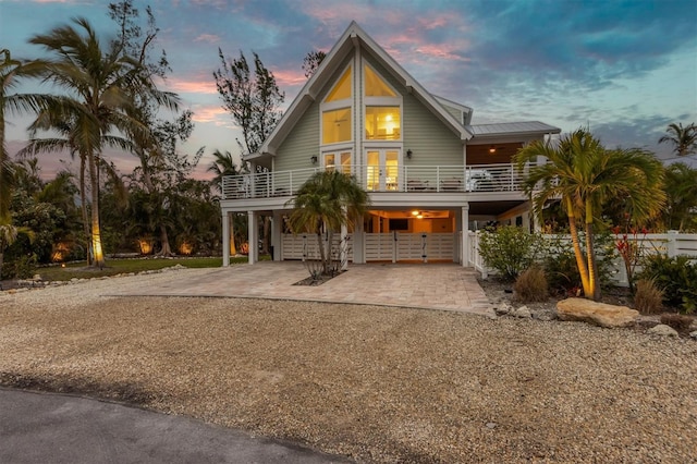 view of front of house featuring a carport and a balcony