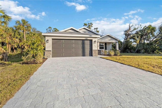 ranch-style home with a garage and a front yard