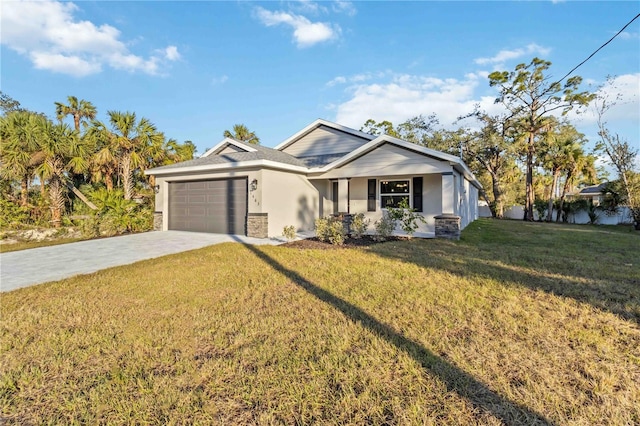 view of front of home with a garage and a front lawn