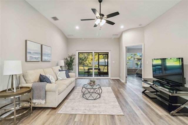 living room featuring ceiling fan and light wood-type flooring