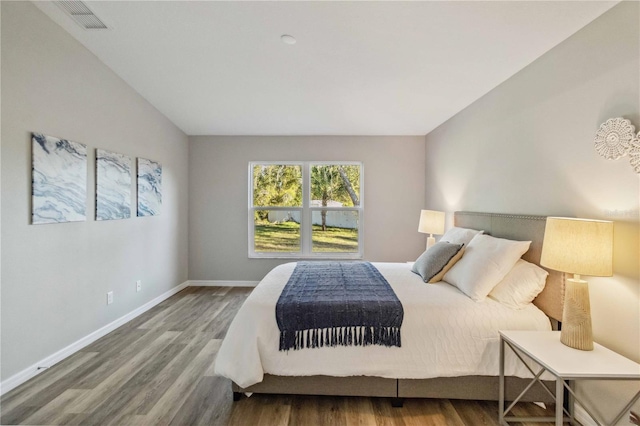 bedroom with hardwood / wood-style flooring