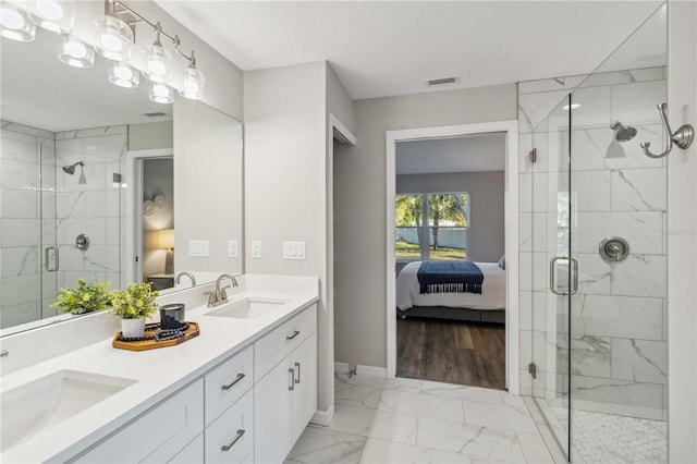 bathroom featuring vanity, a textured ceiling, and walk in shower