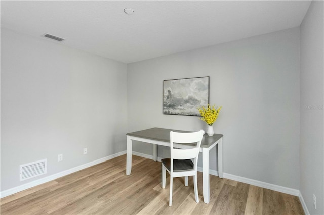 office space with light wood-type flooring