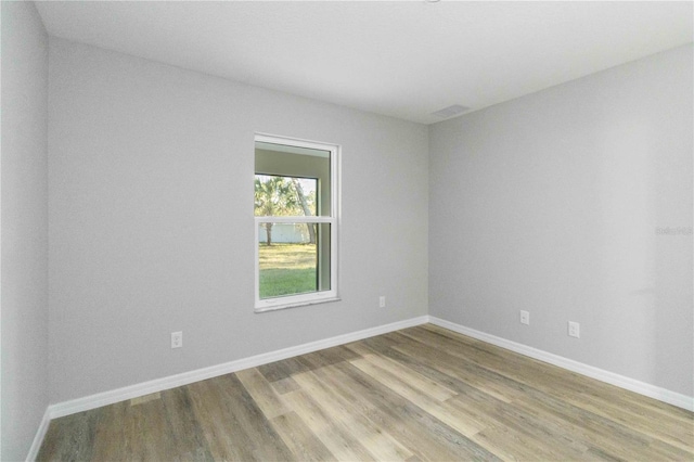 unfurnished room featuring light wood-type flooring