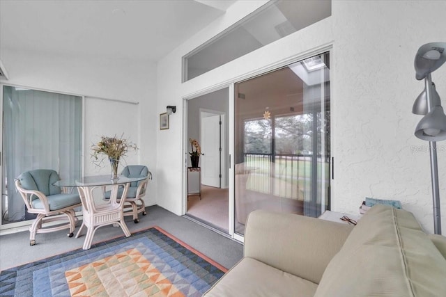 sunroom featuring vaulted ceiling