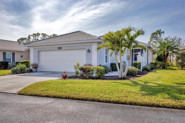 ranch-style house featuring a front yard and a garage