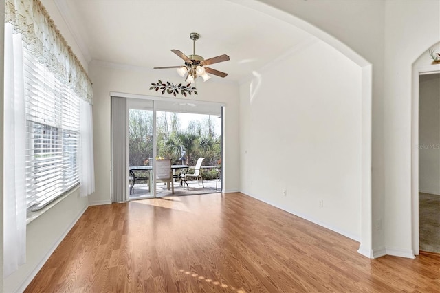 unfurnished dining area with ceiling fan, hardwood / wood-style floors, and ornamental molding