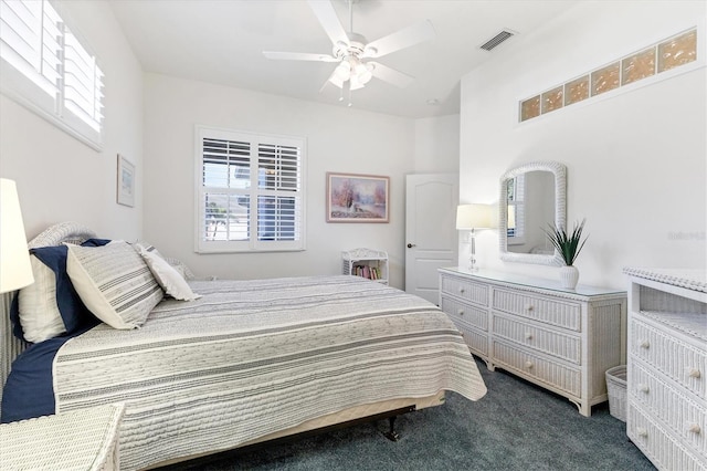 carpeted bedroom featuring ceiling fan