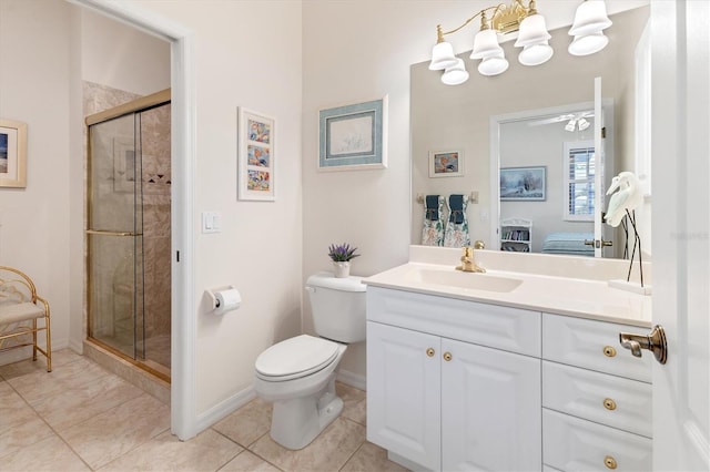 bathroom featuring vanity, a shower with shower door, tile patterned floors, and toilet