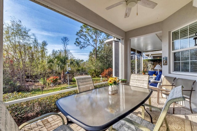 sunroom / solarium with ceiling fan