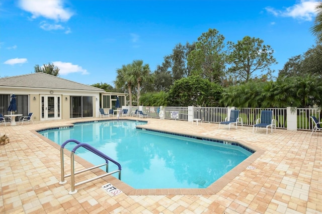 view of swimming pool with a patio area