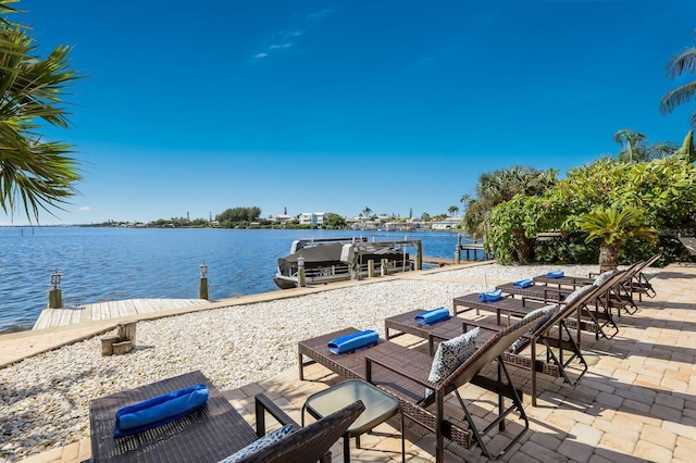 exterior space featuring a water view and a dock