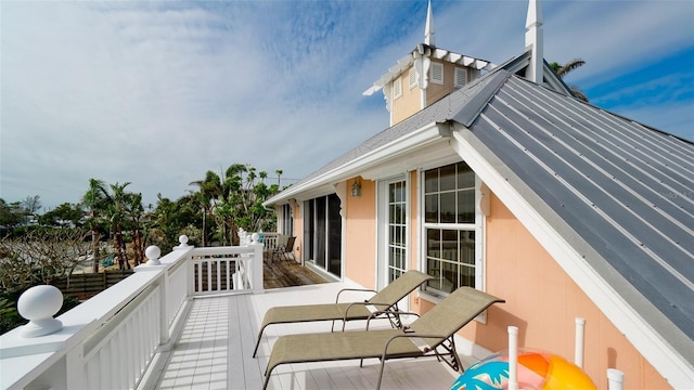 wooden balcony featuring a deck