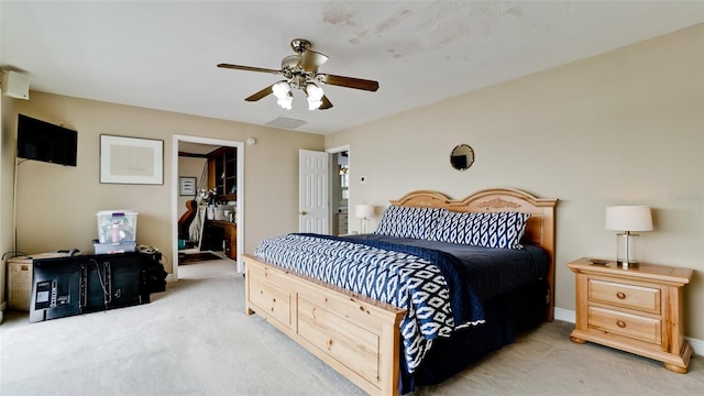 bedroom featuring ceiling fan and light carpet