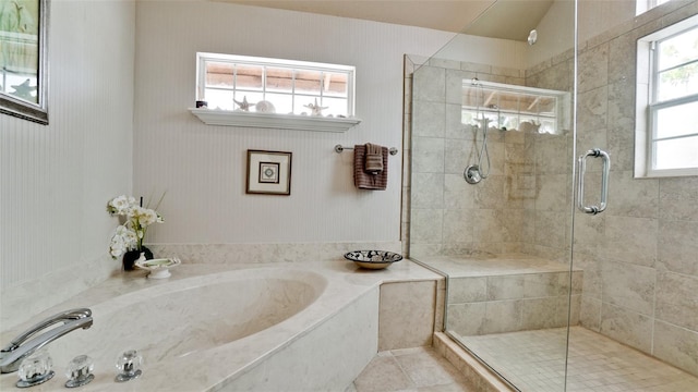 bathroom with separate shower and tub, tile patterned flooring, and plenty of natural light