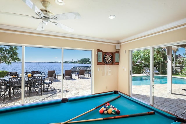 playroom with ceiling fan, billiards, ornamental molding, and a water view